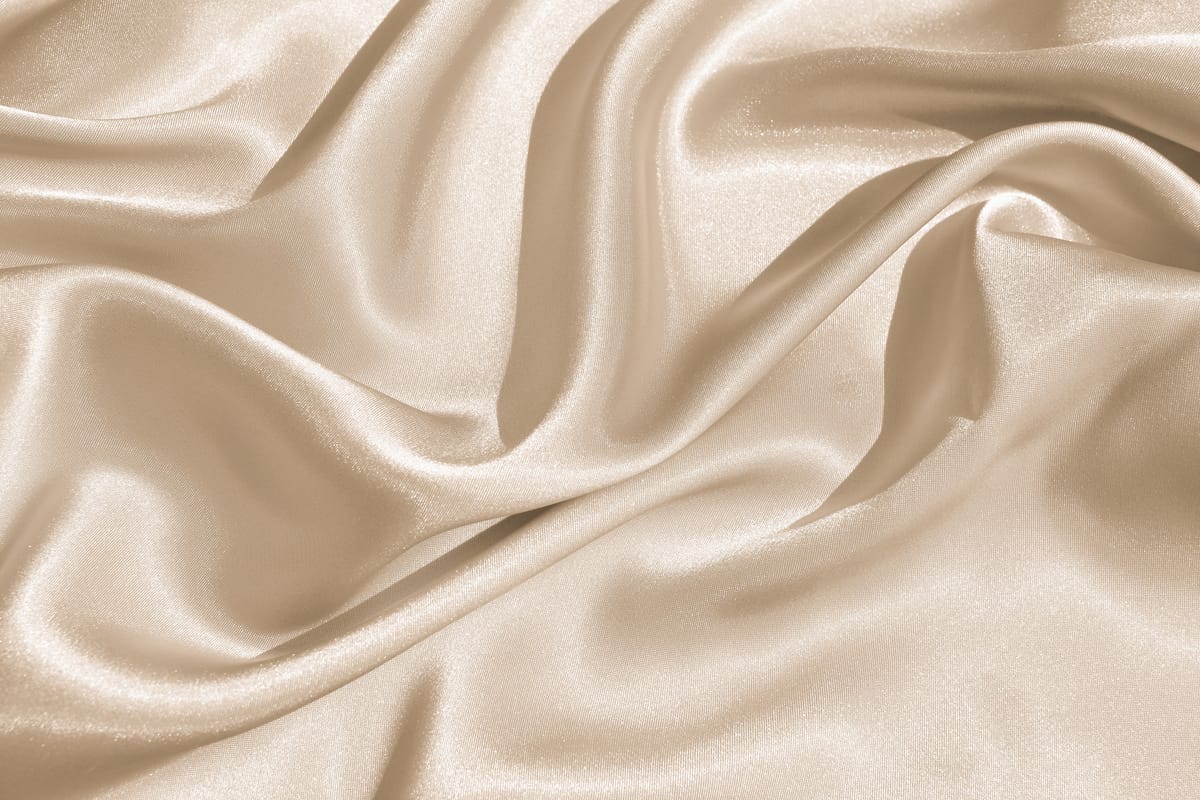 Tecido de seda em tons de creme